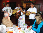 Diners enjoy the food and music at El Pintos. 