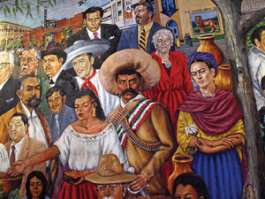 Mural at La Tierra restaurant in El Mercado depicts ordinary people interspersed with community leaders and historic figures. 