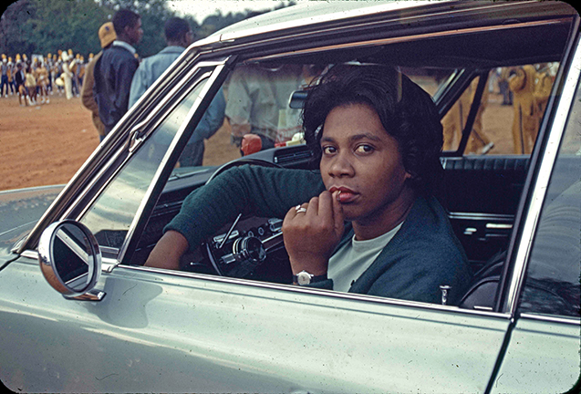 October 1966. Woman in a car during the homecoming parade for Booker T. Washington High School in Montgomery. Photo by Jim Peppler.