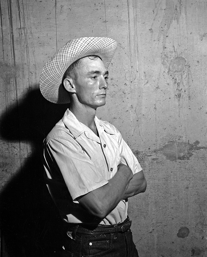 1951. Man in jeans and cowboy hat, probably a participant in the Alabama State Rodeo at Garrett Coliseum in Montgomery. Photo by Horace Perry.