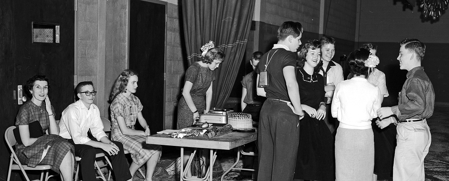 1959. Students talking in the gym during a dance at Capitol Heights Junior High School in Montgomery. (Horace Perry photographer)
