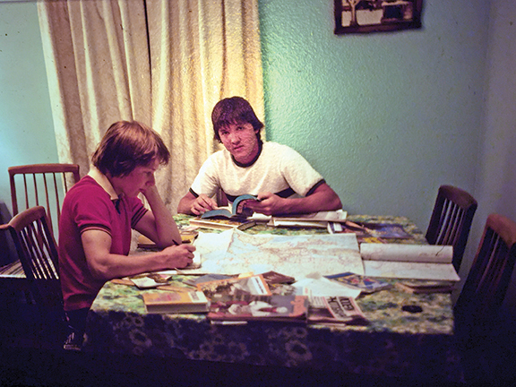 (1976) Author John Peck (R) and his brother plan their cross-country bike route.
