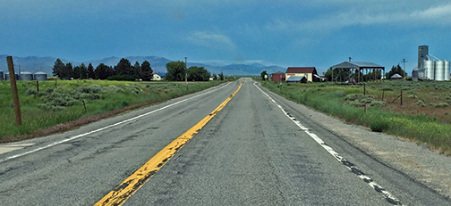 The same Idaho road, 2016, silos and building intact.